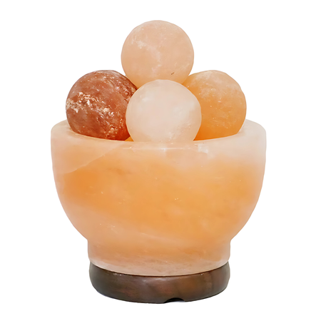 Fire bowl Himalayan salt lamp filled with glowing pink salt spheres on a timber base.