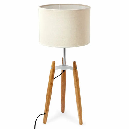 Bamboo tripod floor lamp with beige linen shade for stylish ambient lighting