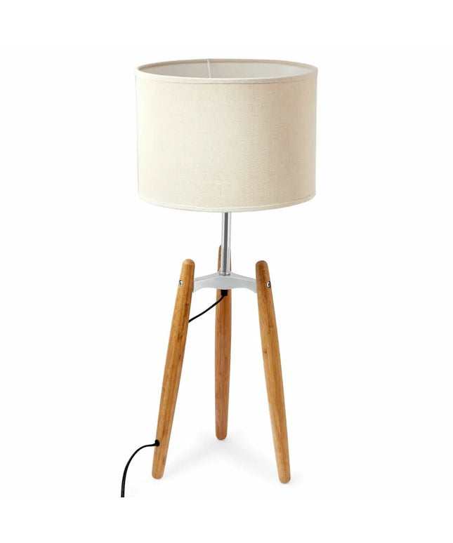 Bamboo tripod floor lamp with beige linen shade for stylish ambient lighting