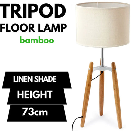 Bamboo tripod floor lamp with beige linen shade for elegant lighting