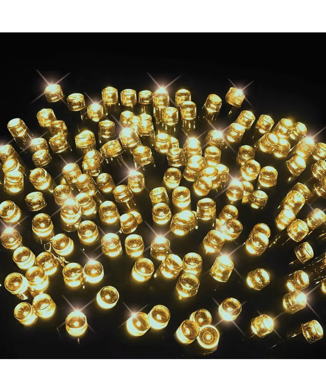 Illuminated golden LED lights on Battery Operated 100 LED Timer Lights in warm white