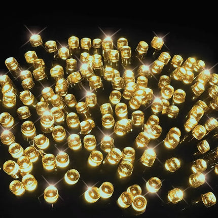 Illuminated golden LED string lights from Battery Operated 300 LED Timer Lights in warm white