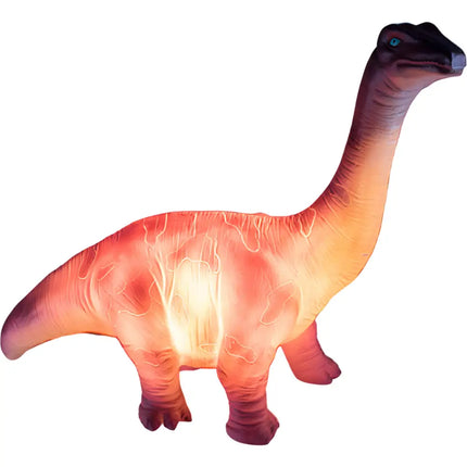 Brachiosaurus Table Lamp glowing softly in a child’s bedroom