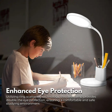 White desk lamp with integrated pen and phone holder for organized workspace