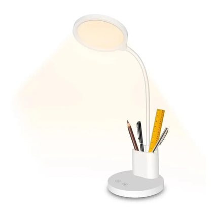Illuminated white desk lamp with built-in pen and phone holder for organized workspace
