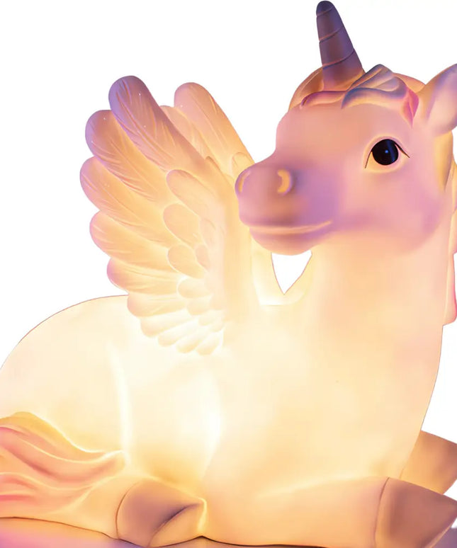 Giant Unicorn Table Lamp glowing softly in a bedroom