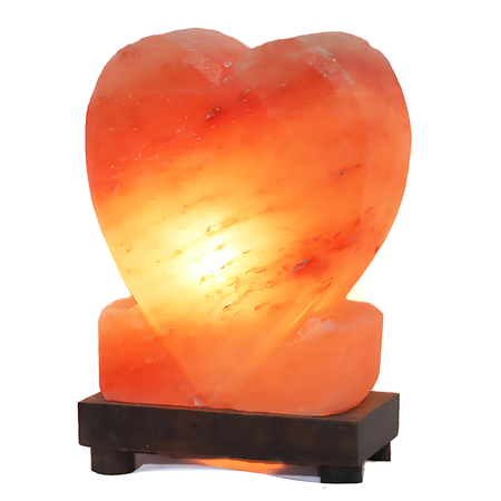 Hand-carved upright heart Himalayan salt lamp, showcasing a soft amber glow on a sturdy timber base.