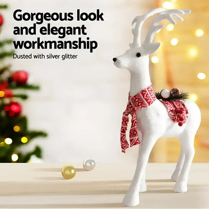 White reindeer figurine with red patterned scarf from Jingle Jollys Christmas Glitter Deer ornament collection