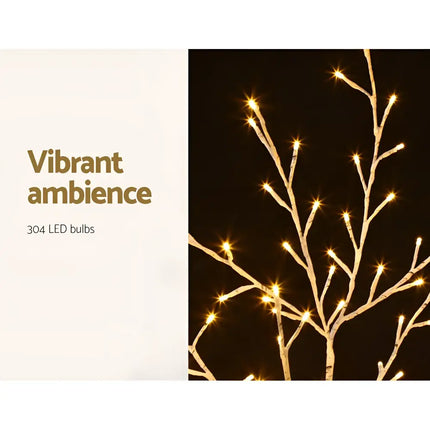 Illuminated decorative tree branches from Jingle Jollys Christmas Tree 2.1M with warm white LEDs