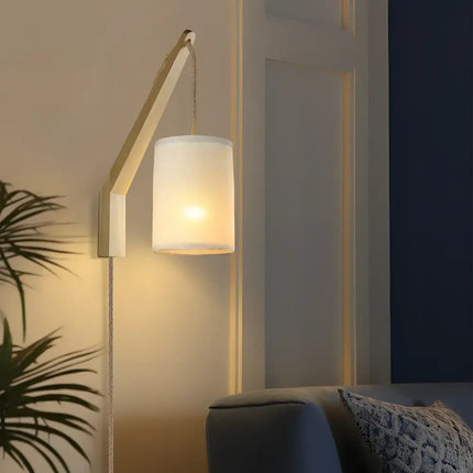 Wall-mounted Kya Wall Light with a sleek cylindrical shade for modern illumination