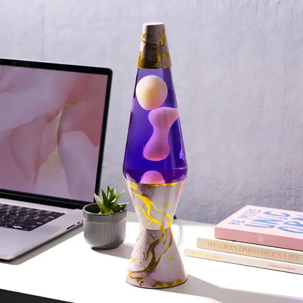 Edgy Diamond-Shaped Lava Lamp with purple liquid and hypnotic pink lava.