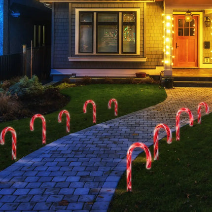 Illuminated candy cane pathway decorations for festive outdoor lighting display