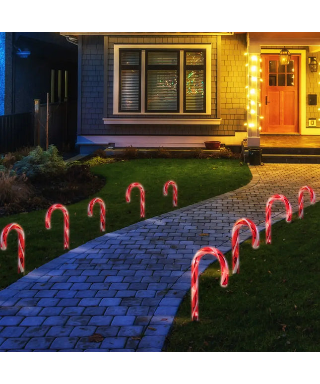 Illuminated candy cane pathway decorations for festive outdoor lighting display