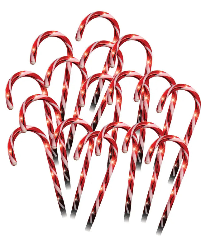 Red and white striped LED Candy Canes Path Lights decorated with string lights for festive ambiance