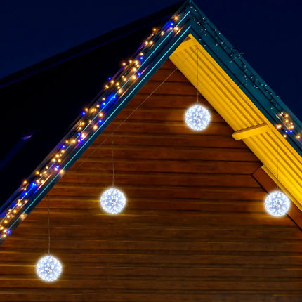 Illuminated spherical hanging LED decorations in warm and cool white for festive ambiance