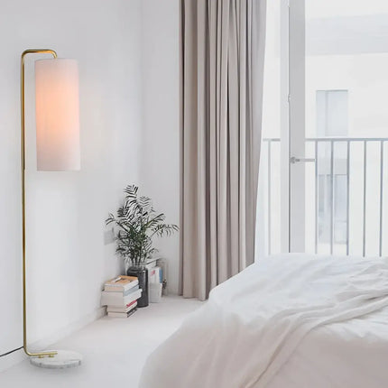 Illuminated gold floor lamp from Lexi ADELE collection featuring metal and marble design