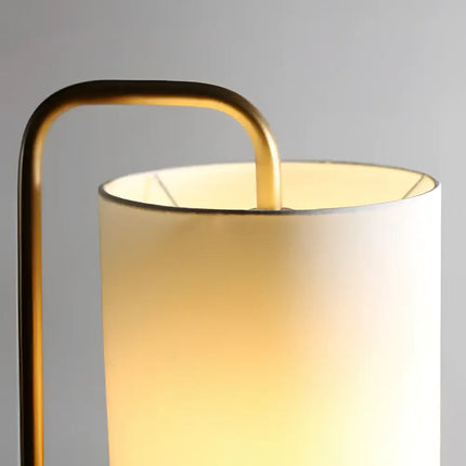 Illuminated cylindrical lamp with brass frame from Lexi ADELE Metal and Marble Floor Lamp collection