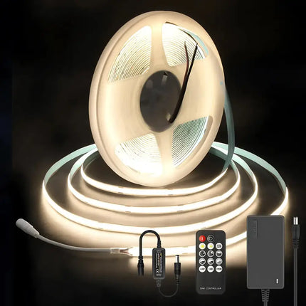 LED strip light set with remote control and power adapter on a dark background