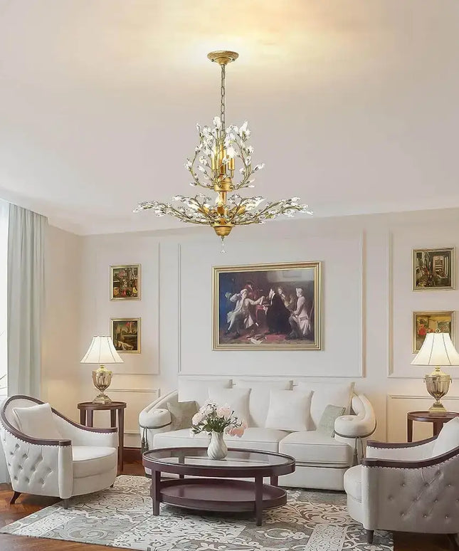 Gold crystal chandelier hanging in a stylish living room
