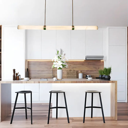 Madison Antique Brass Spanish Marble Tri-Colour LED Pendant Light illuminating a modern kitchen island