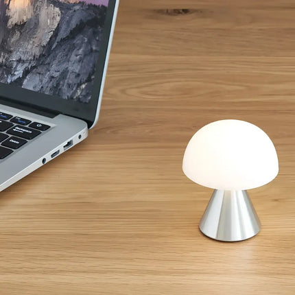 Mushroom-shaped Mina Mini LED Lamp with silver base and glowing white shade