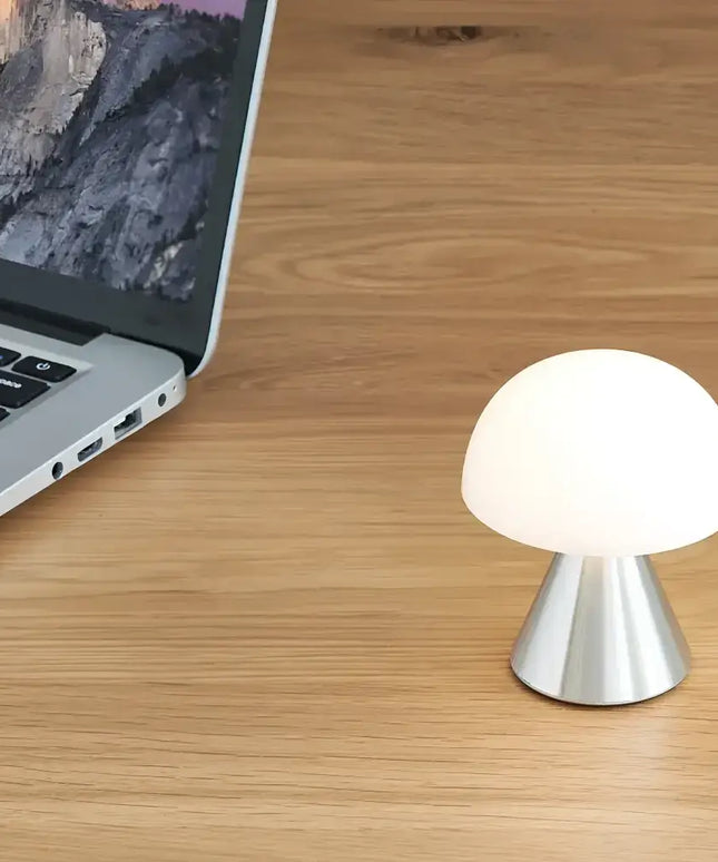 Mushroom-shaped Mina Mini LED Lamp with silver base and glowing white shade