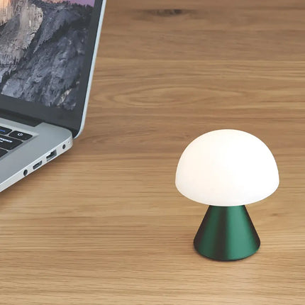 Green mushroom lamp from Mina Mini Led Lamp series providing ambient lighting