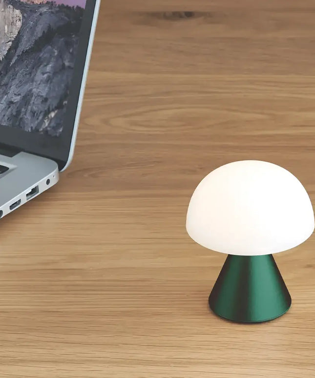 Green mushroom lamp from Mina Mini Led Lamp series providing ambient lighting