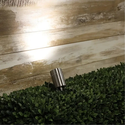 Cylindrical stainless steel outdoor light for garden illumination on the Oriel Accent Spike Light
