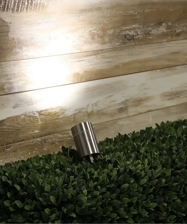 Cylindrical stainless steel outdoor light for garden illumination on the Oriel Accent Spike Light