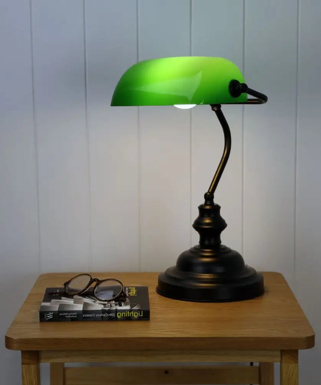 Oriel Bankers Touch Table Lamp with a green shade and brass base.