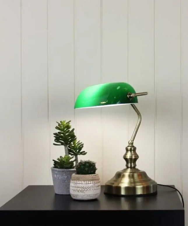 Side view of the Oriel Bankers lamp with touch functionality on a wooden desk.