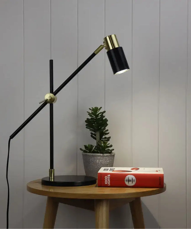 Sleek and modern Oriel CHARLIE LED desk lamp on a work desk