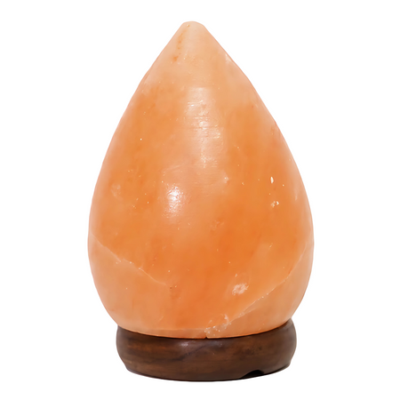 Pear-shaped Himalayan salt lamp with a timber base, glowing warmly in a cozy setting.