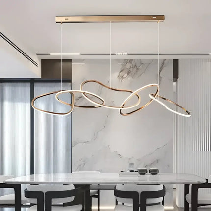 Modern rose gold LED pendant light featuring an adjustable circular chandelier design