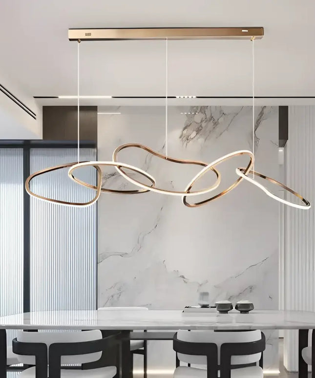 Modern rose gold LED pendant light featuring an adjustable circular chandelier design