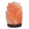 Rose-shaped Himalayan salt lamp with a timber base, glowing warmly in a cozy setting Melbourne.