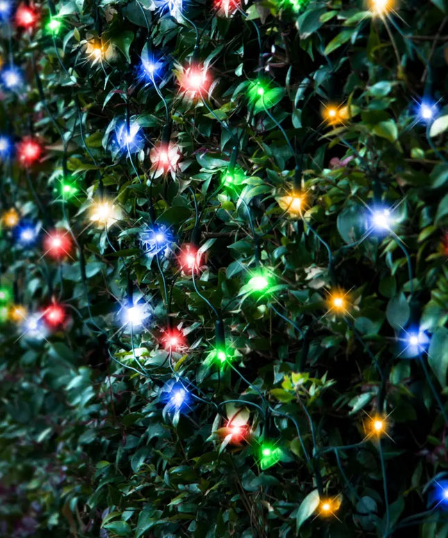 Colorful string lights on leafy bush for Solar 250 LED Net Light available in 3 Colors Multicolor