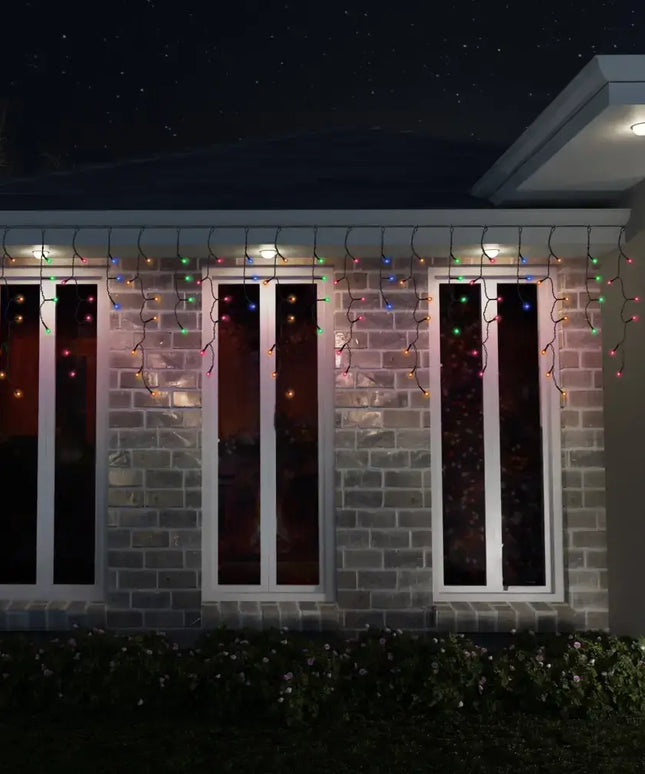 Festive icicle Christmas lights displayed on Solar 400 LED Icicle Lights in three cool white colors