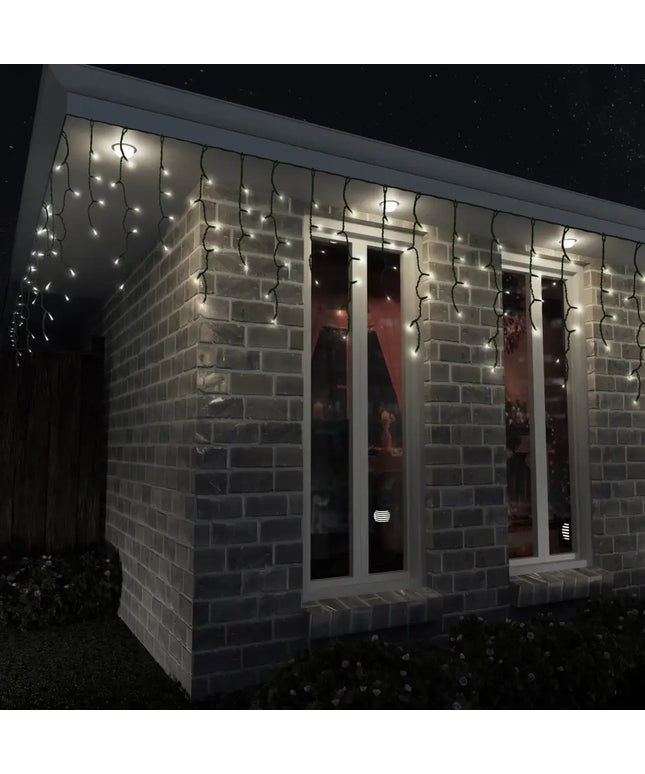 Brick building decorated with Solar 400 LED Icicle Lights in Warm White color
