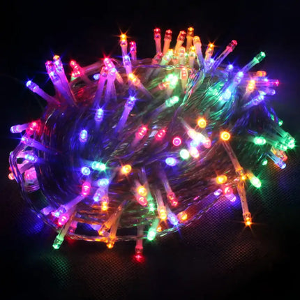 Tangled multicolored Christmas string lights for outdoor garden decor at night