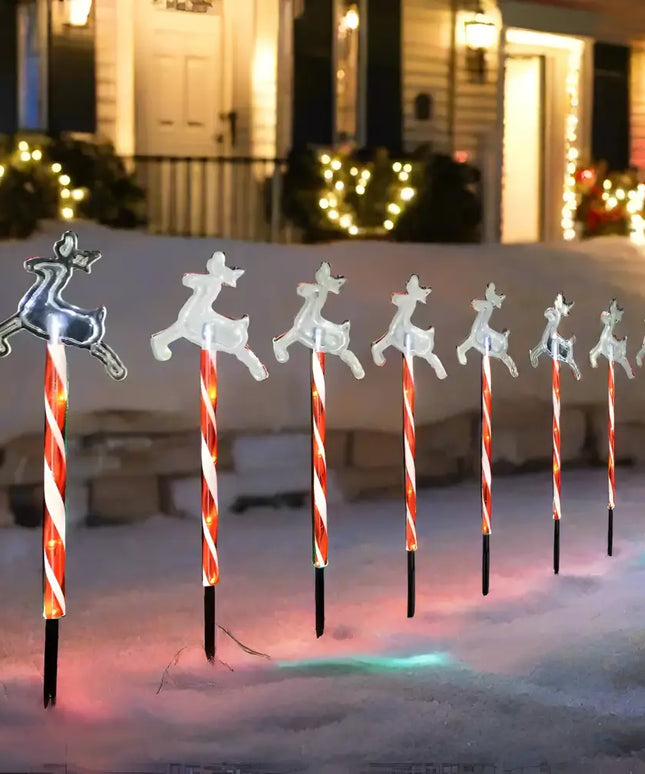 Illuminated reindeer Candy Cane pathway markers with solar LED lights in cool white