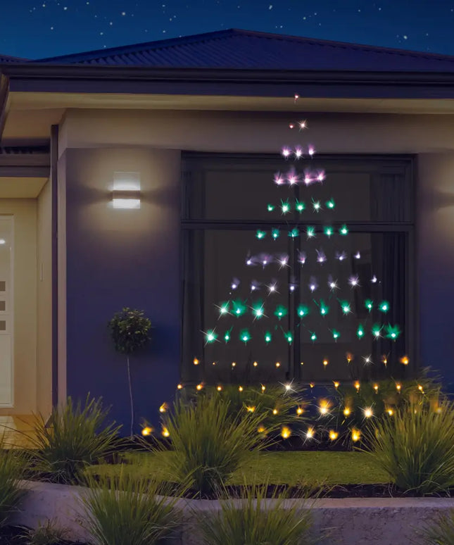 Illuminated Christmas tree window display with Solar LED Rainbow Christmas Tree Wall Net Lights