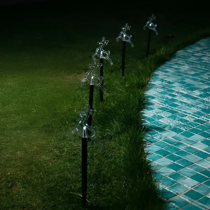Illuminated reindeer lawn ornaments from Solar Reindeer Path Lights 5 Pack in multicolor