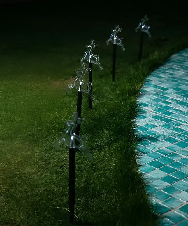 Illuminated reindeer lawn ornaments from Solar Reindeer Path Lights 5 Pack in multicolor