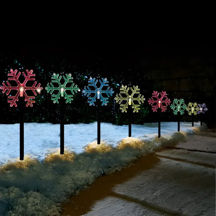 Illuminated snowflake pathway lights from Solar Snowflake Path Lights 5 Pack in multicolor