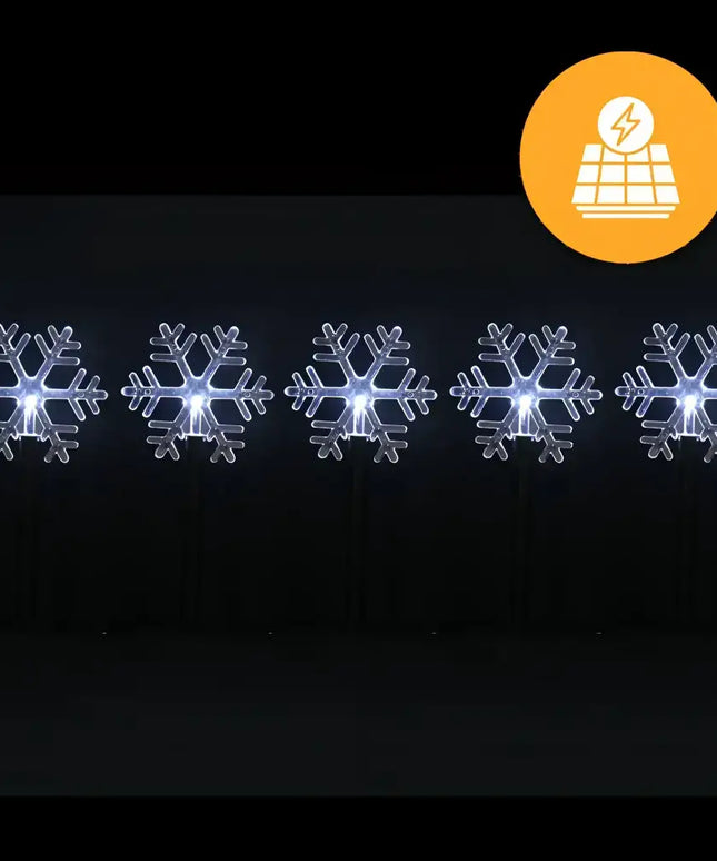 Illuminated snowflake lawn decorations from Solar Snowflake Path Lights 5 Pack in Cool White