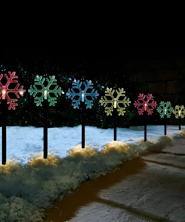 Illuminated snowflake pathway lights from Solar Snowflake Path Lights 5 Pack in Cool White