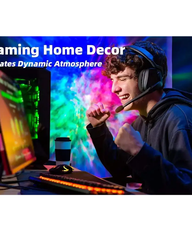 Excited gamer wearing a headset enjoying the Star Projector Galaxy Light Bedroom connected with Alexa and Google Home
