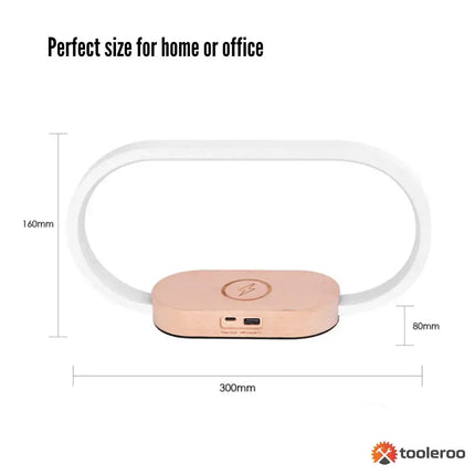 Oval wireless charging table lamp with dimmable light and integrated clock for bedside or office use